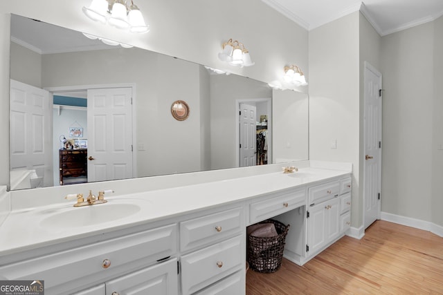 64 Lake No No Rd, Midway, GA 31320 - bathroom featuring crown molding, wood-type flooring, and vanity