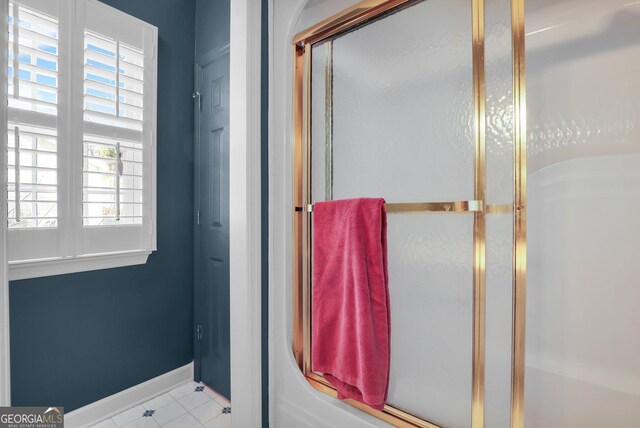 64 Lake No No Rd, Midway, GA 31320 - bathroom featuring a shower with shower door and tile patterned floors