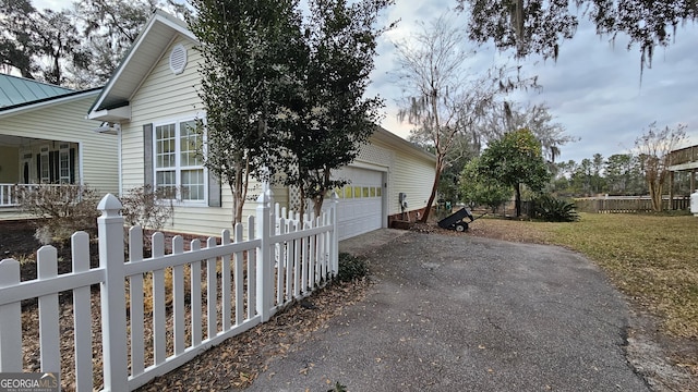 64 Lake No No Rd, Midway, GA 31320 - view of side of property featuring driveway and a garage