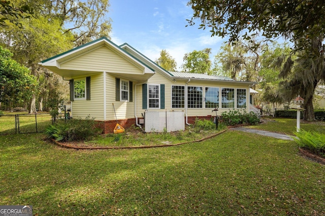 64 Lake No No Rd, Midway, GA 31320 - back of house with a metal roof