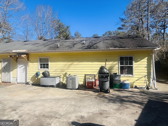 back of property with a patio and cooling unit