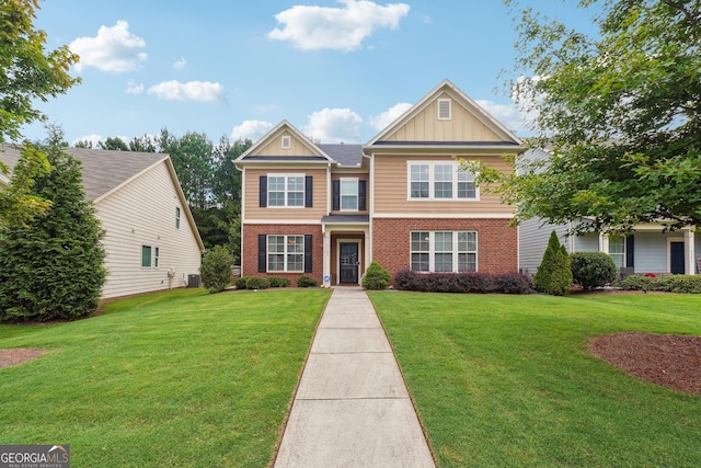 view of front of home with cooling unit and a front lawn