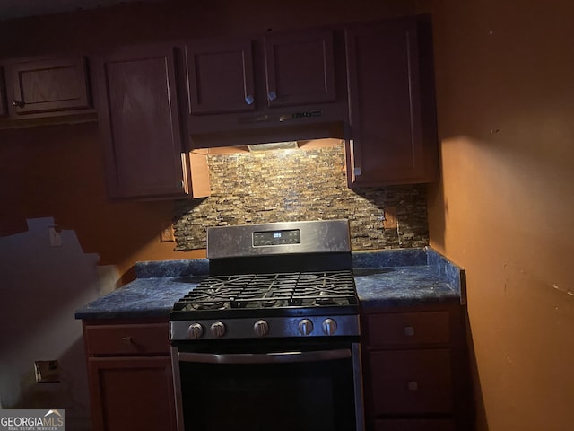 kitchen featuring decorative backsplash and gas stove