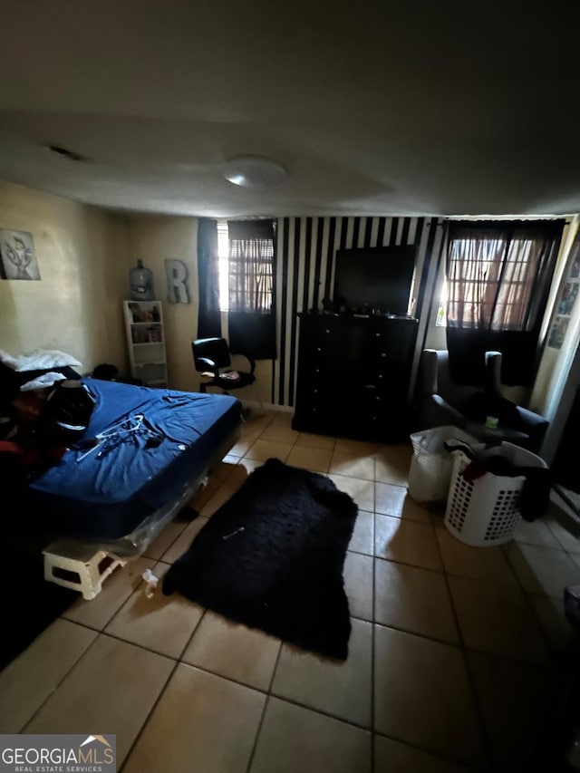 bedroom featuring light tile patterned floors