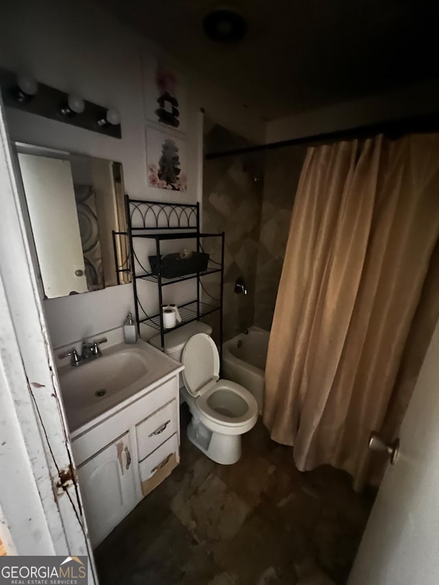 full bathroom with shower / tub combo, vanity, and toilet