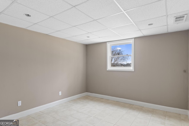 empty room with a paneled ceiling