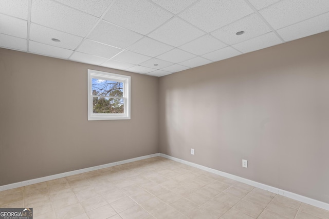 spare room with a drop ceiling