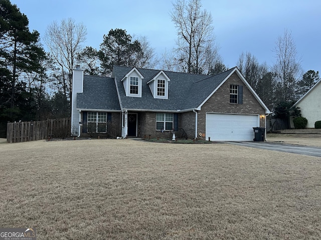 view of front of house featuring a garage and a front yard