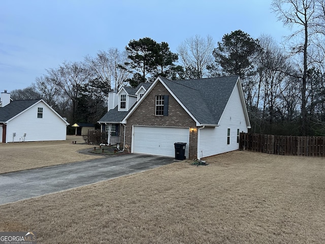 view of side of property with a garage