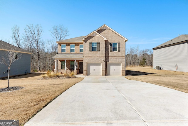 view of front facade featuring a garage, a porch, and a front lawn