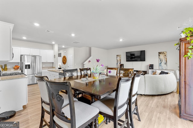 dining room featuring light wood-type flooring