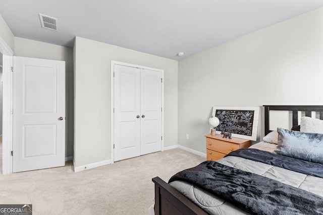 carpeted bedroom featuring a closet