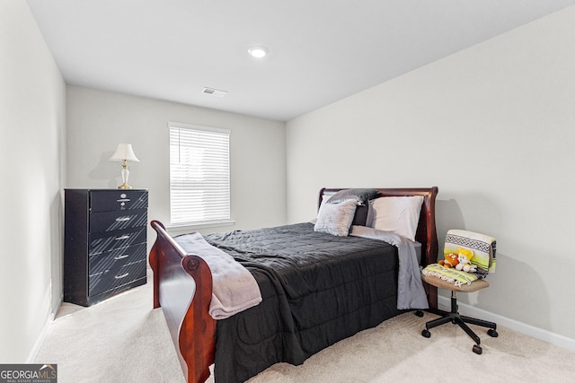 bedroom with light colored carpet