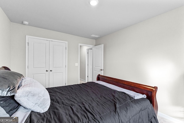 carpeted bedroom with a closet