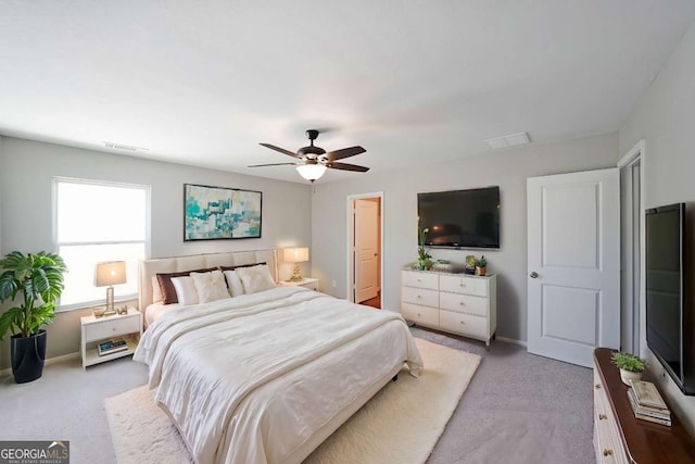 carpeted bedroom with ceiling fan