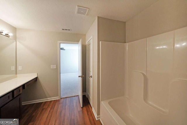 bathroom with hardwood / wood-style flooring and vanity