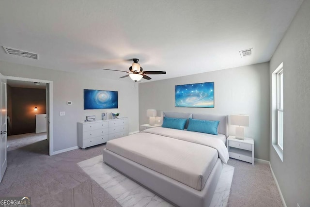 carpeted bedroom with ceiling fan