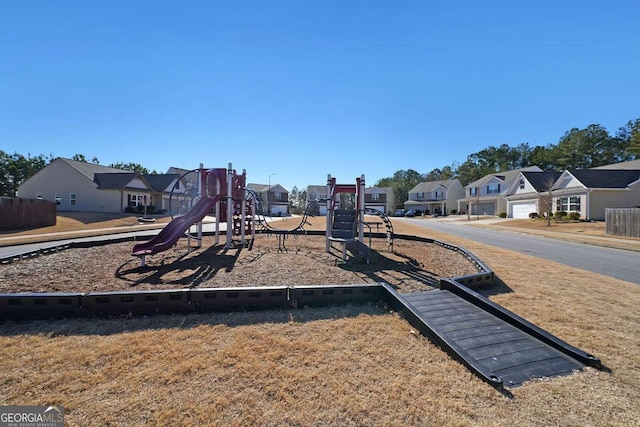 view of jungle gym featuring a lawn