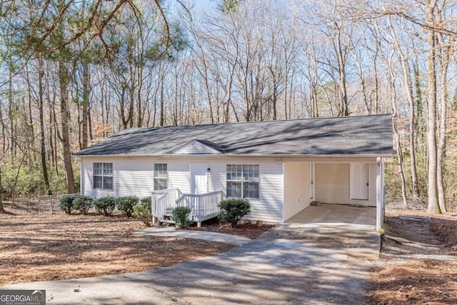 single story home featuring a carport