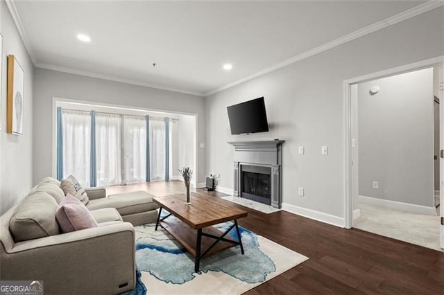 living room with ornamental molding and dark hardwood / wood-style floors