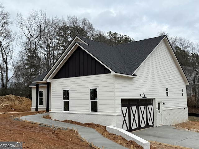 view of side of home with a garage