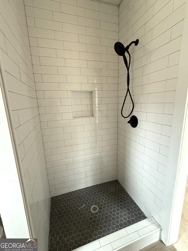 bathroom with a shower stall