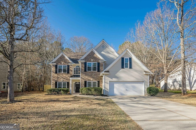 view of front of home featuring a garage and a front yard