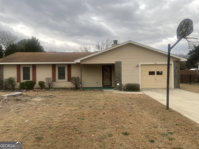 ranch-style home with a garage and a front yard