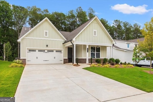 view of front of property featuring a garage and a front lawn