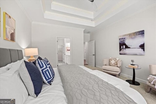 bedroom with crown molding, ensuite bath, a raised ceiling, and light carpet