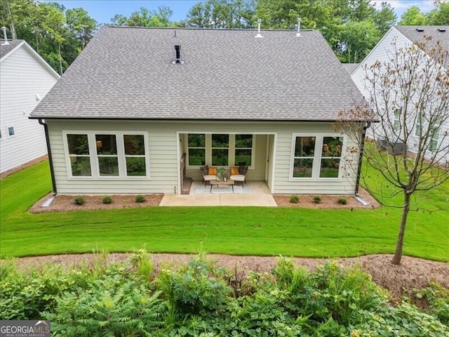 back of property featuring a patio and a lawn