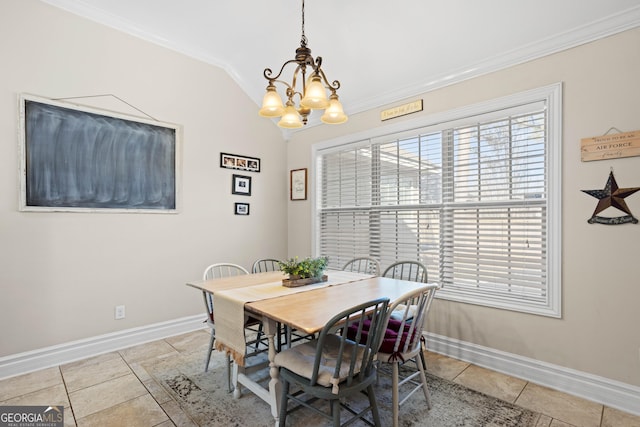 dining room with a notable chandelier, light tile patterned floors, vaulted ceiling, and ornamental molding