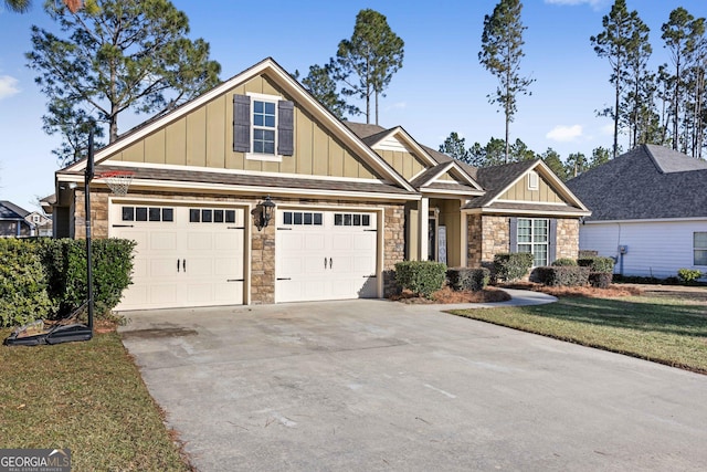 craftsman-style home with a garage and a front yard