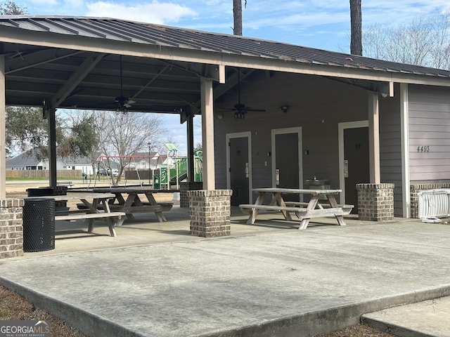 view of property's community with a playground, a gazebo, and a patio area