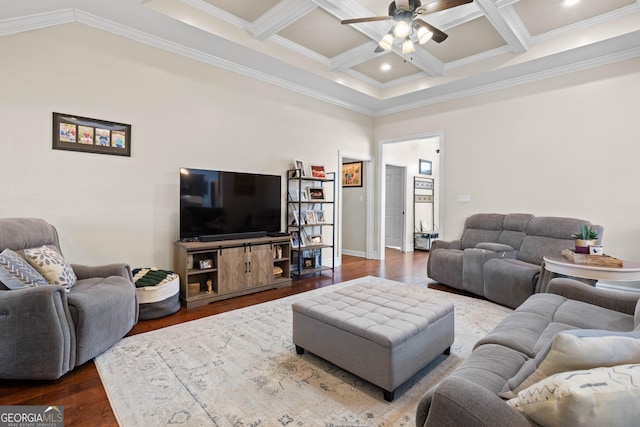 living room with ceiling fan, hardwood / wood-style floors, coffered ceiling, ornamental molding, and beamed ceiling