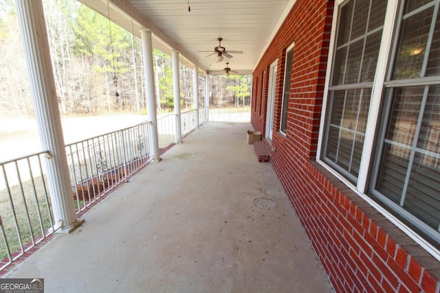 view of patio featuring ceiling fan and a porch