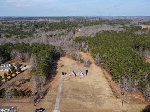 birds eye view of property with a rural view