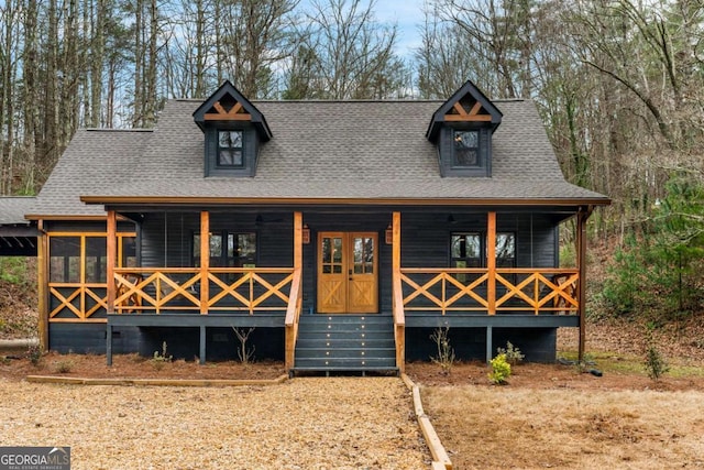 view of front of house featuring a porch and a shingled roof