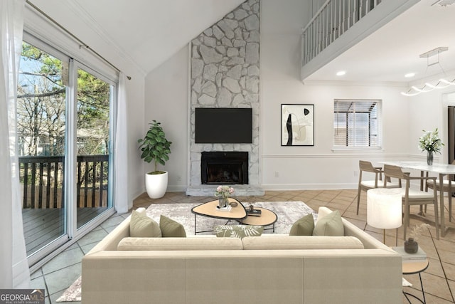 tiled living room featuring crown molding, a fireplace, and high vaulted ceiling