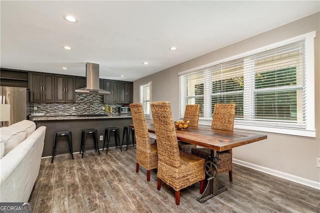 dining room with dark hardwood / wood-style flooring