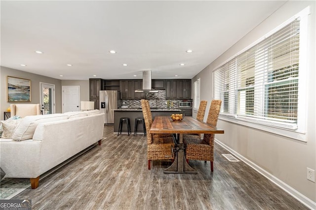 dining room featuring hardwood / wood-style floors and a wealth of natural light