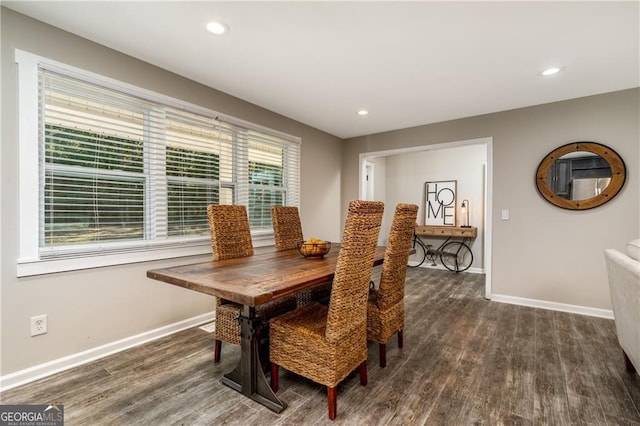 dining area with dark hardwood / wood-style flooring