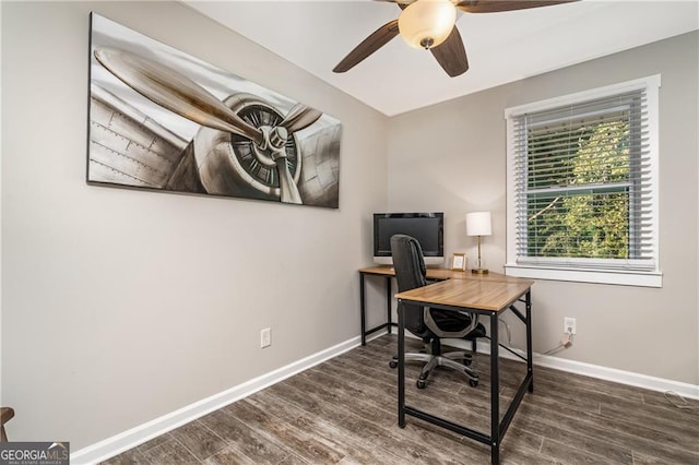 office area with dark wood-type flooring and ceiling fan