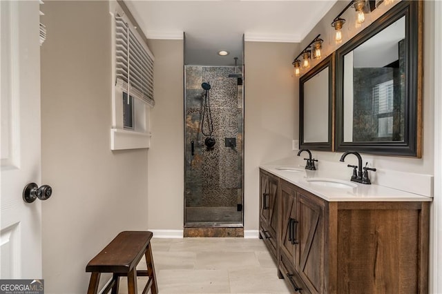 bathroom with vanity, ornamental molding, and a shower with door