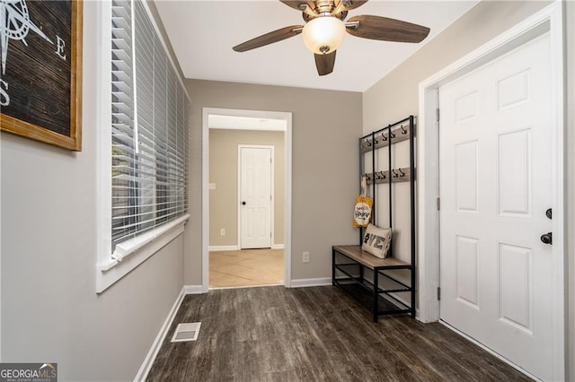 interior space featuring ceiling fan and dark hardwood / wood-style floors