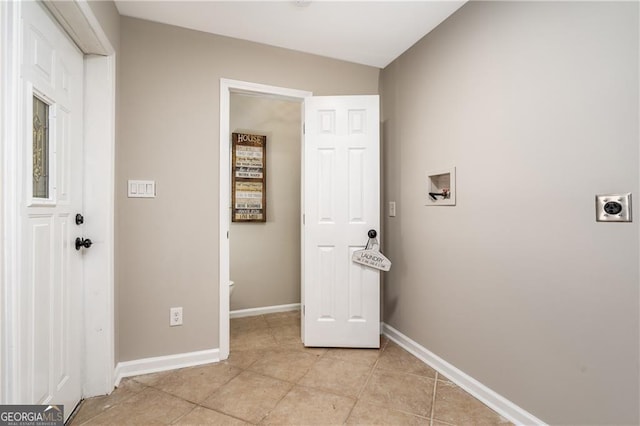 laundry room featuring hookup for a washing machine, electric dryer hookup, and light tile patterned floors