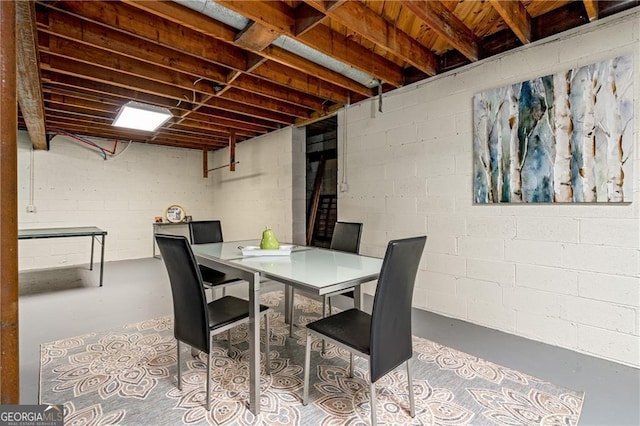 dining area featuring concrete flooring