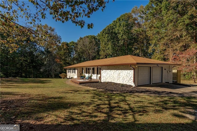 exterior space featuring a garage and a front lawn