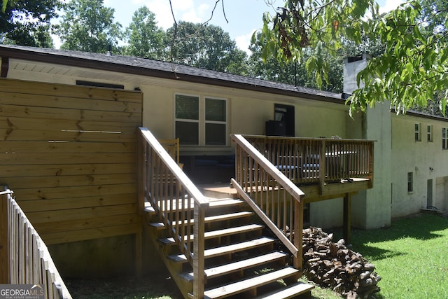 back of house featuring a deck