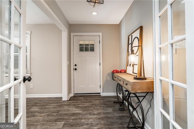 foyer with dark hardwood / wood-style floors and french doors